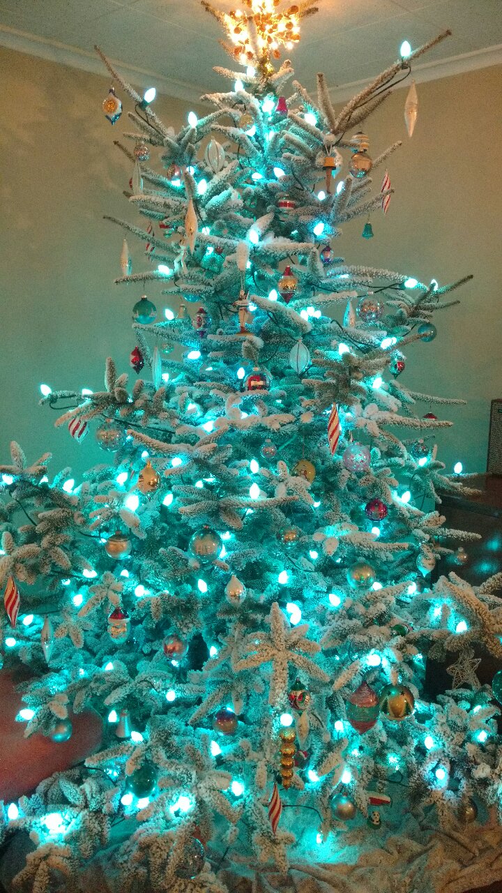 Flocked tree with lights and ornaments